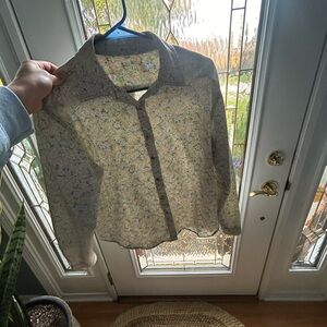 Blouse floral print not sure of brand tag is off does like a medium.